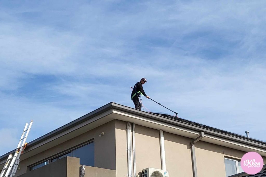 cleaning solar panels on roof